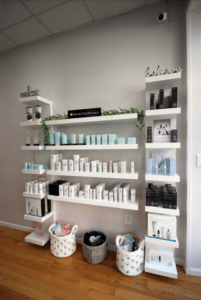 shelving and skincare products in the sale of an aesthetics business in the western boston area